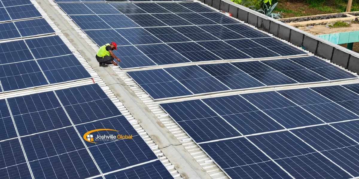 Joshville installer working on a rooftop solar-panel array